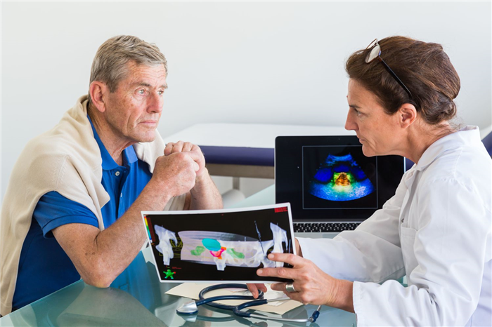 Doctor discussing prostate ultrasound scan with a patient